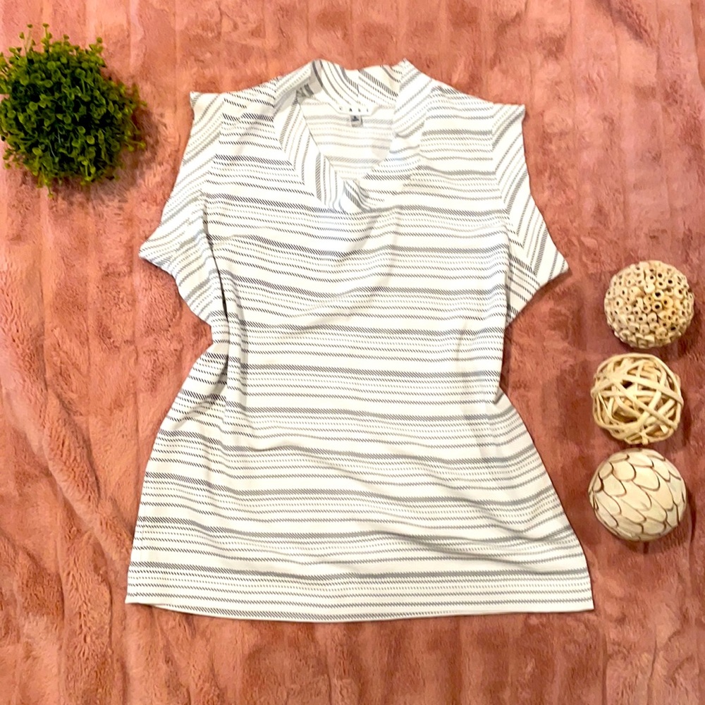Black and white sleeveless CAbi blouse